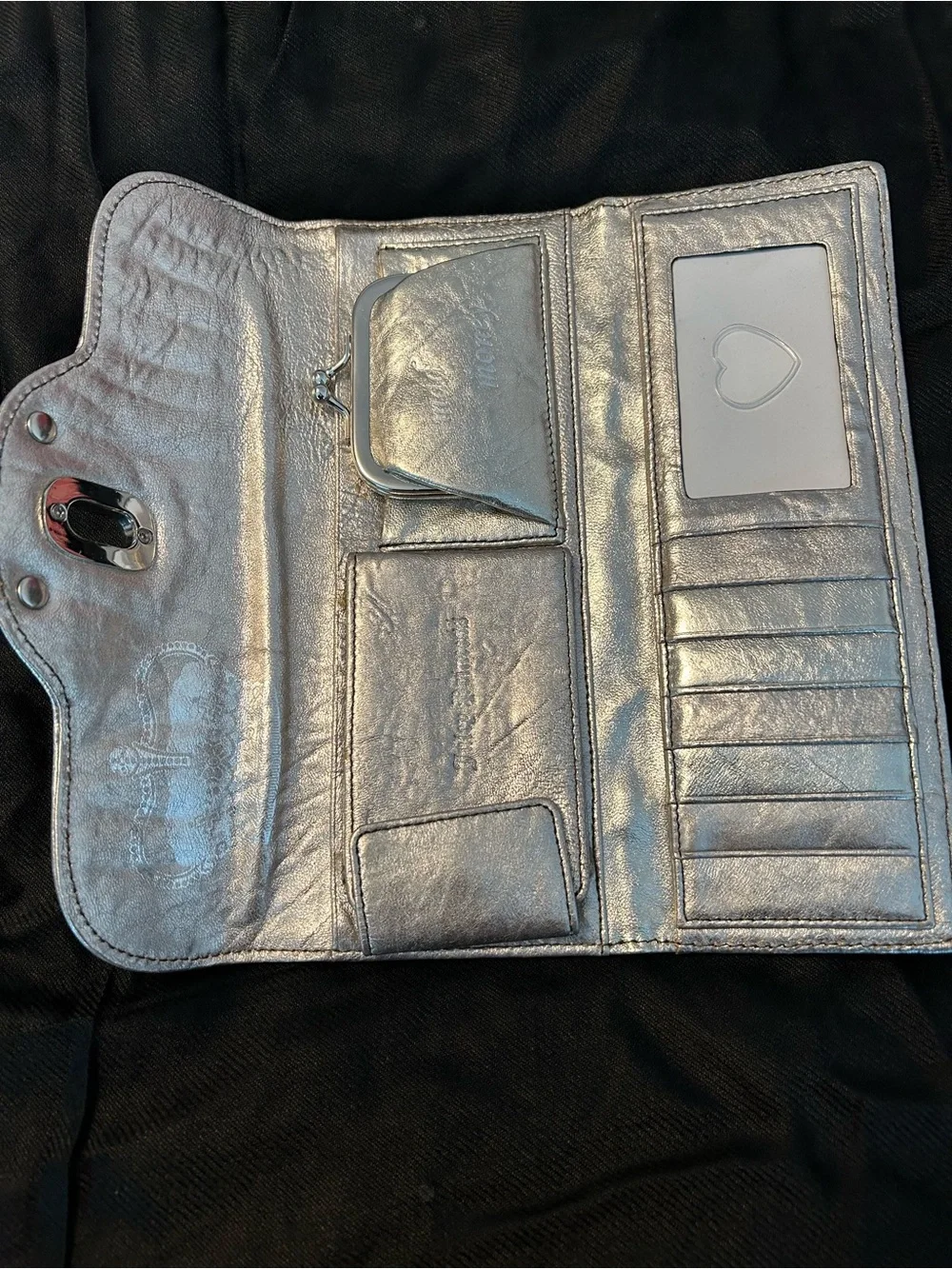 Juicy Couture Silver Leather Woman’s Clutch/Wallet with silver chain trim.